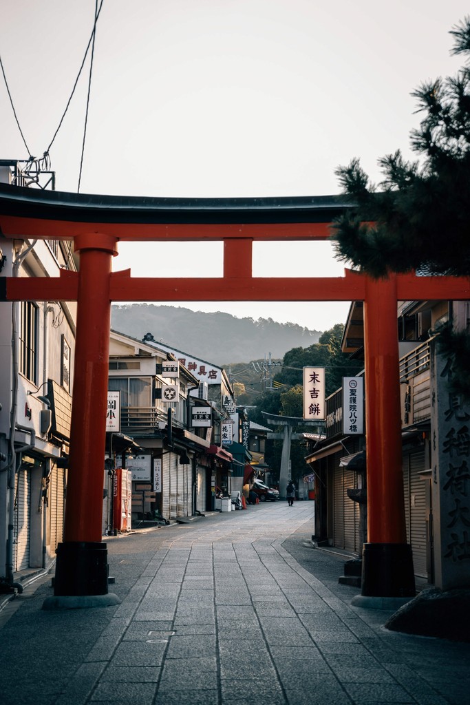 Ancient classical temple ruins beside a modern city, representing destination history paired with corporate travel